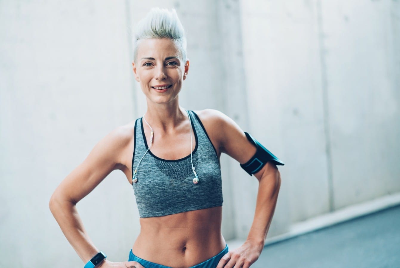 Woman demonstrating active aging through strength training and fitness exercises for longevity and healthspan optimisation